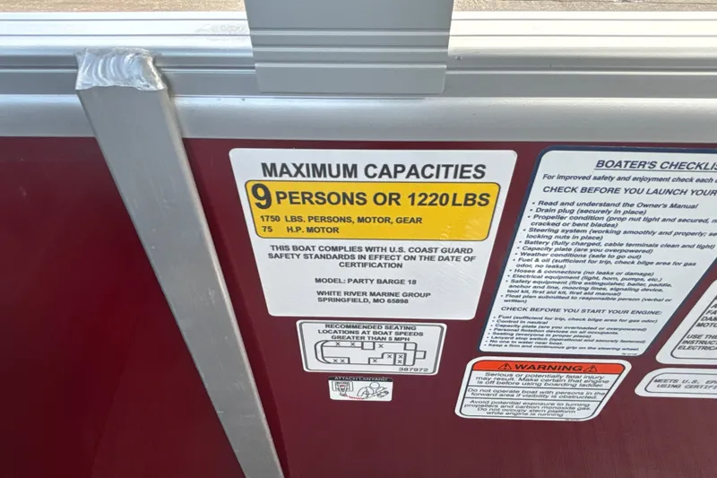 Slide: The Image of 2026 Sun Tracker Party Barge 18 DLX capacity label, 9 persons or 1220 lbs limit. - 35