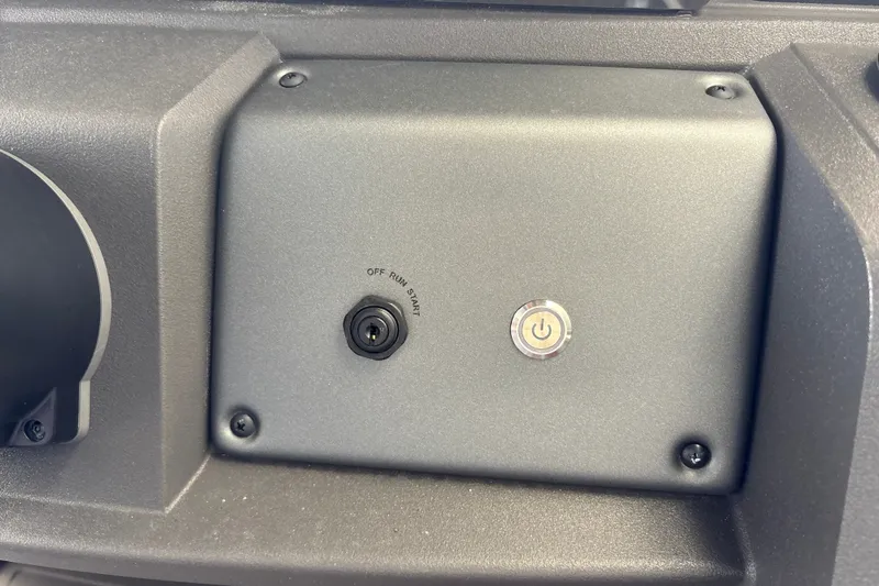 Slide: The Image of Control panel of 2026 Sun Tracker Party Barge 18 DLX with ignition switch and power button. - 26