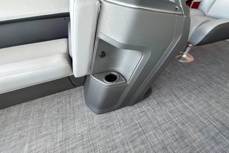 Slide: The Image of Interior of 2026 Sun Tracker Party Barge 18 DLX with seating and cup holder. - 22