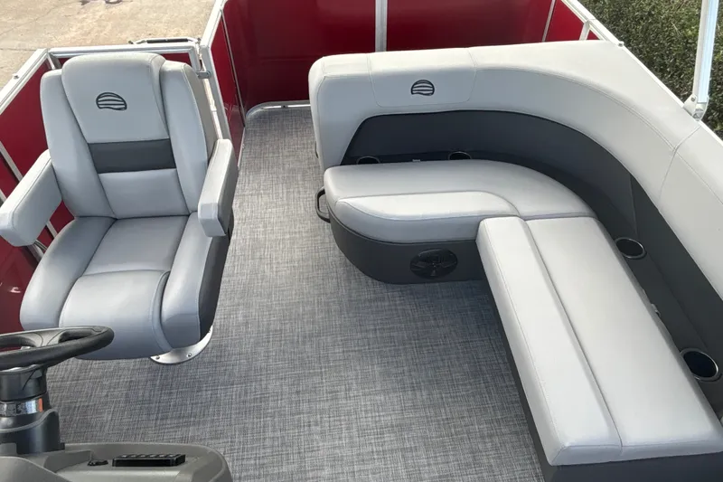 Slide: The Image of 2026 Sun Tracker Party Barge 18 DLX interior with gray seating and modern design. - 16