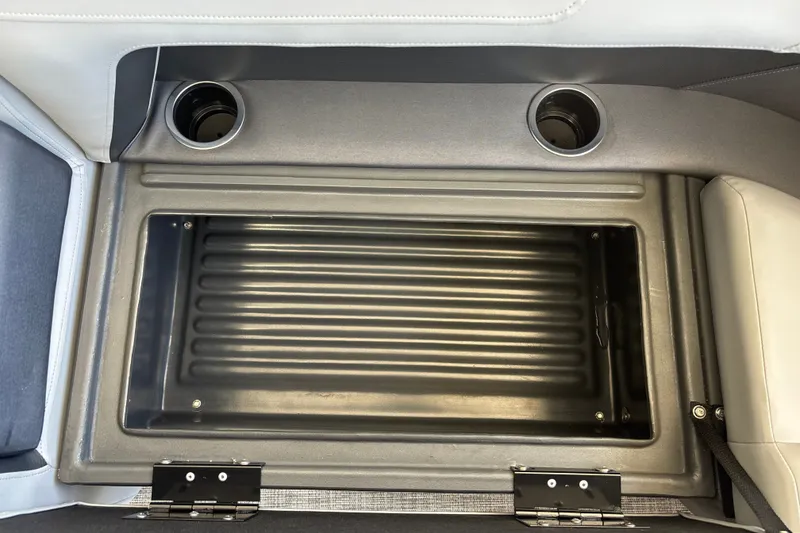 Slide: The Image of Interior storage compartment of 2026 Sun Tracker Party Barge 18 DLX with cup holders. - 28