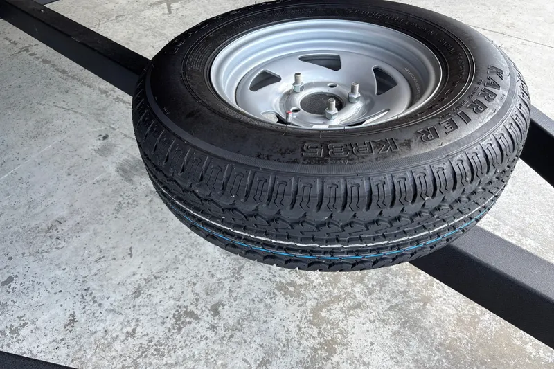 Slide: The Image of Spare tire mounted on a trailer for a 2026 Sun Tracker Party Barge 18 DLX. - 36