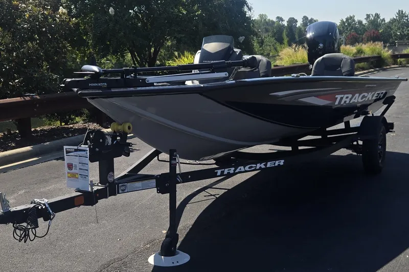 The Image of 2026 Tracker Pro Team 175 Crappie Edition boat on trailer in parking lot. - 0