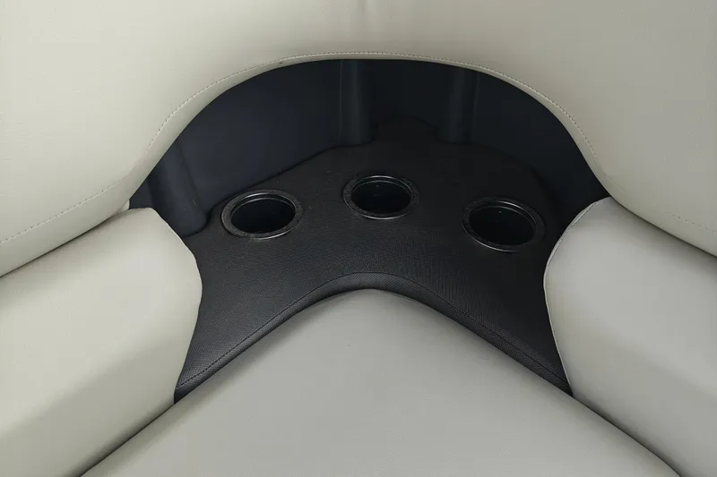 Slide: The Image of 2026 Sun Tracker Fishin' Barge 20 DLX boat seating with integrated cup holders. - 15