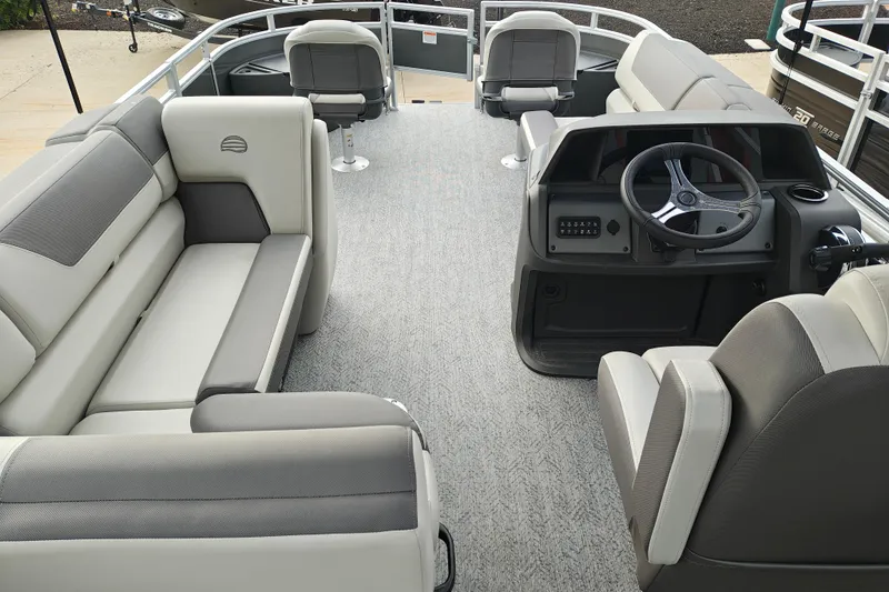Slide: The Image of 2026 Sun Tracker Fishin' Barge 20 DLX interior with plush seating and modern helm. - 27
