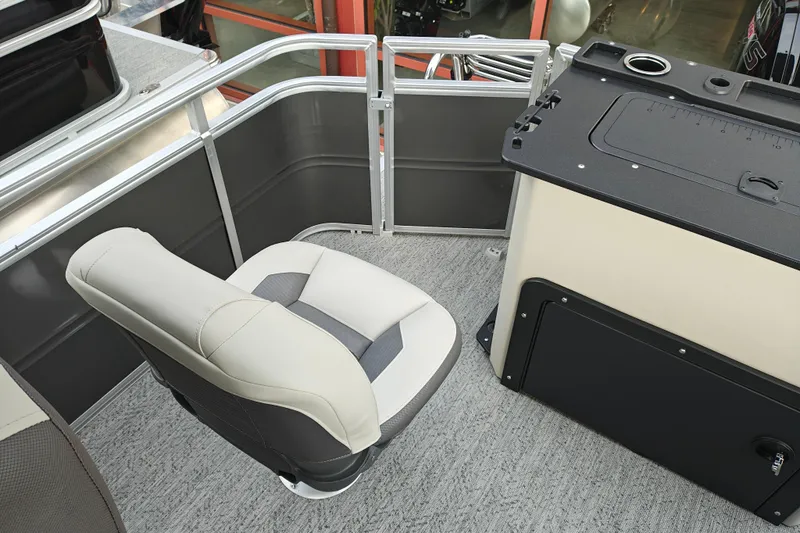 Slide: The Image of 2026 Sun Tracker Fishin' Barge 20 DLX interior with seating and fishing station. - 19
