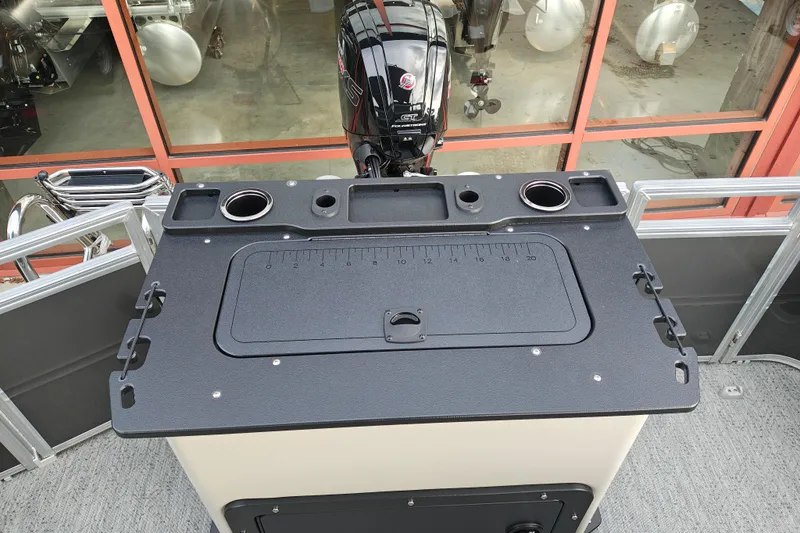 Slide: The Image of 2026 Sun Tracker Fishin' Barge 20 DLX boat with fishing station and motor. - 20
