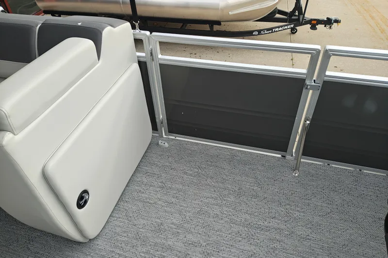 Slide: The Image of Interior view of 2026 Sun Tracker Fishin' Barge 20 DLX with seating and railing. - 12