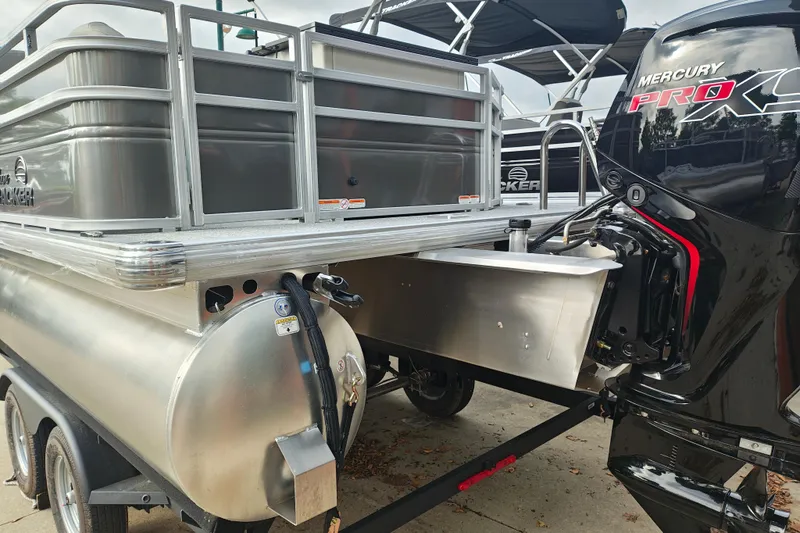 Slide: The Image of 2026 Sun Tracker Fishin' Barge 20 DLX with Mercury Pro motor, docked on trailer. - 5