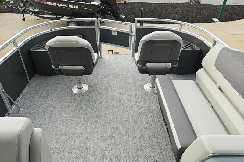 Slide: The Image of 2026 Sun Tracker Fishin' Barge 20 DLX interior with seating and fishing chairs. - 32