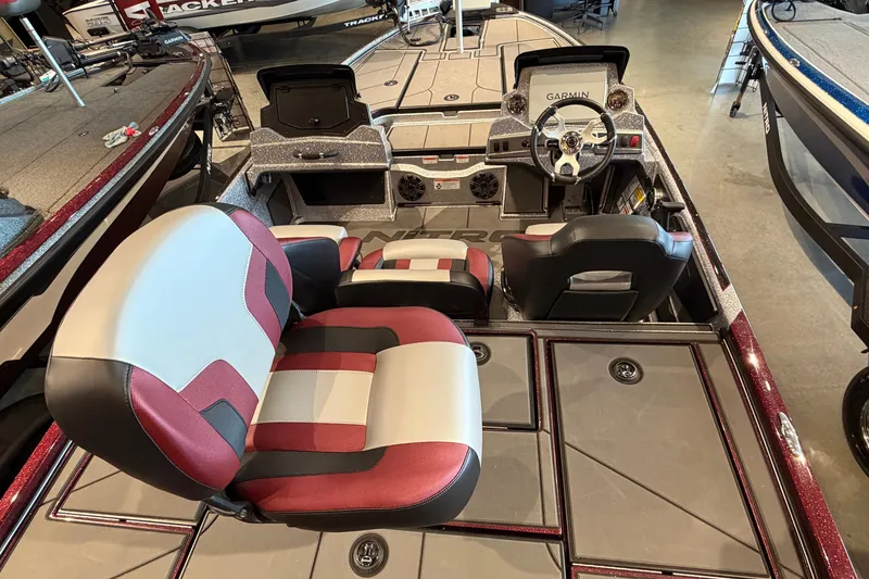 Slide: The Image of 2026 Nitro Z19 XL Pro boat interior with modern seating and Garmin navigation system. - 4