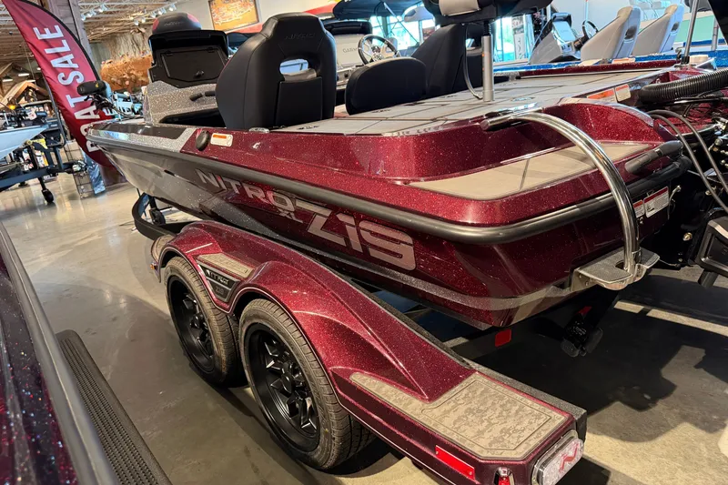 Slide: The Image of 2026 Nitro Z19 XL Pro boat on display in showroom, featuring sleek design and vibrant color. - 2