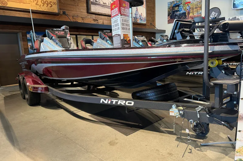 Slide: The Image of 2026 Nitro Z19 XL Pro boat displayed in showroom with price tag. - 1