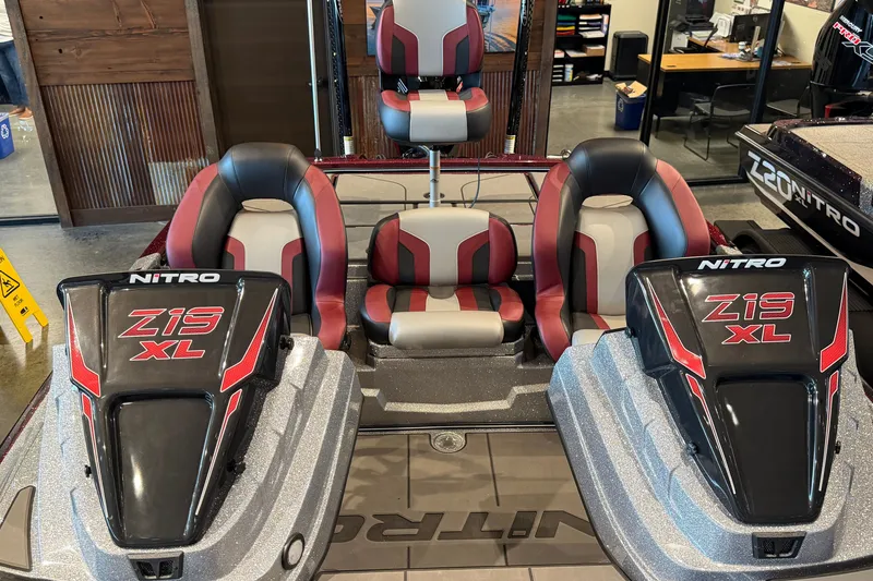 Slide: The Image of 2026 Nitro Z19 XL Pro boat interior with red and black seating. - 6