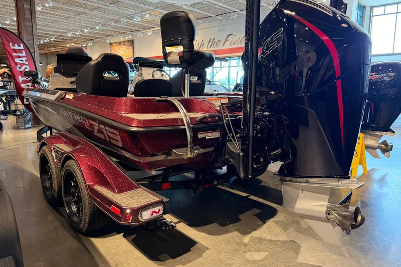 Slide: The Image of 2026 Nitro Z19 XL Pro boat with powerful engine displayed indoors. - 12