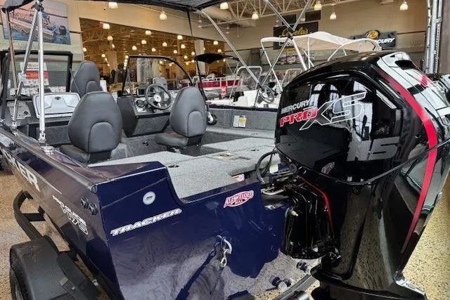 Slide: The Image of 2026 Tracker Pro Guide V-175 Combo boat with Mercury Pro XS engine in showroom. - 5