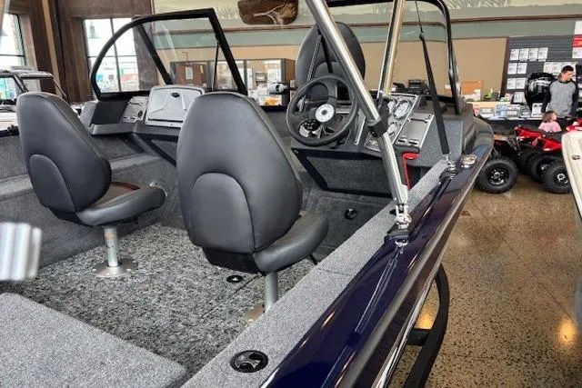 Slide: The Image of 2026 Tracker Pro Guide V-175 Combo boat interior with dual seats and steering console. - 6