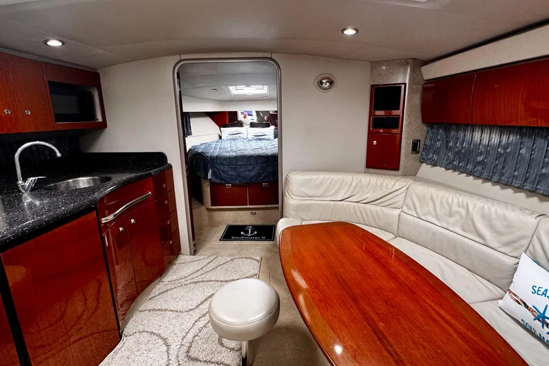 Slide: The Image of Luxurious interior of a 2006 Formula 40 Performance Cruiser with elegant seating and kitchenette. - 10