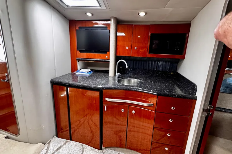 Slide: The Image of Luxurious 2006 Formula 40 Performance Cruiser interior with sleek kitchenette and modern amenities. - 11