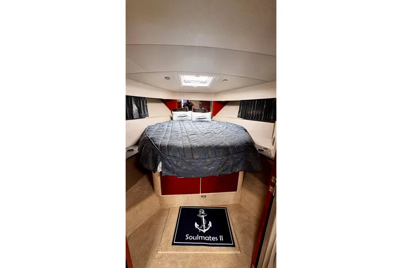 Slide: The Image of Interior cabin of 2006 Formula 40 Performance Cruiser with bed and nautical decor. - 13