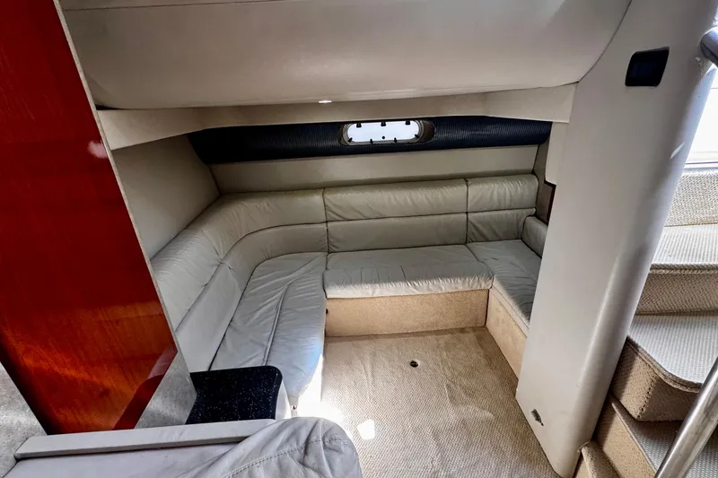 Slide: The Image of 2006 Formula 40 Performance Cruiser interior with beige leather seating and compact design. - 14