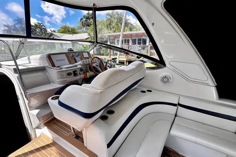 Slide: The Image of 2006 Formula 40 Performance Cruiser cockpit with Garmin navigation, luxurious seating, and modern controls. - 2
