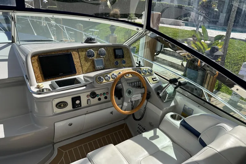 Slide: The Image of 2006 Formula 40 Performance Cruiser cockpit with steering wheel and control panel. - 3