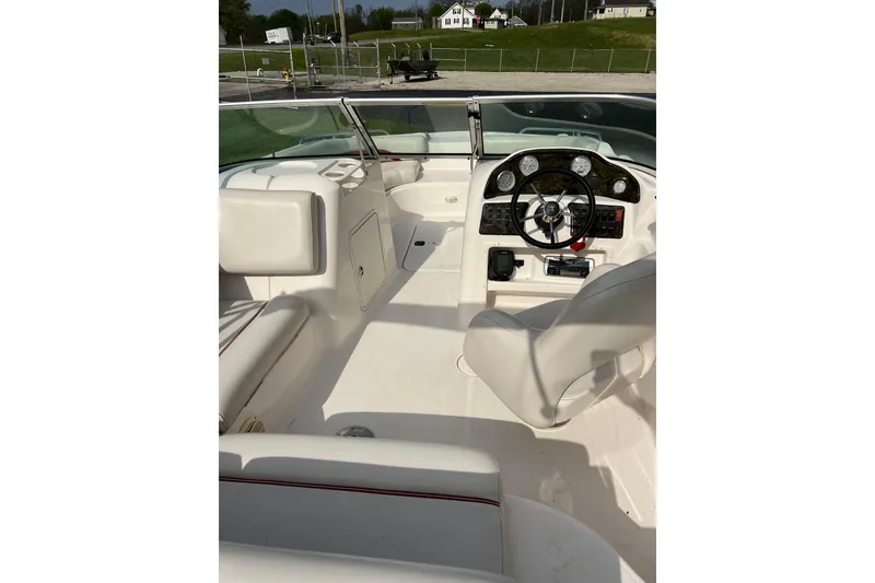 Slide: The Image of 2005 Hurricane SunDeck 187 IO boat interior with steering wheel and seating. - 5