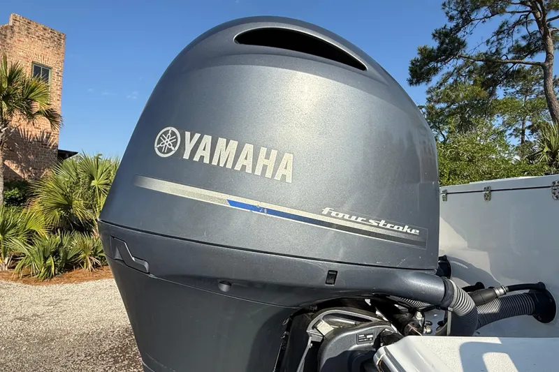 Slide: The Image of Yamaha four-stroke engine on a 2017 Sea Hunt Gamefish 25 boat, outdoors. - 11