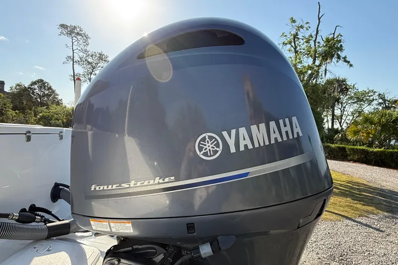 Slide: The Image of Yamaha four-stroke engine on a 2017 Sea Hunt Gamefish 25 boat, sunny day background. - 12