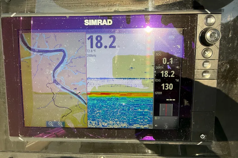 Slide: The Image of Simrad marine display on 2017 Sea Hunt Gamefish 25, showing navigation and sonar data. - 14