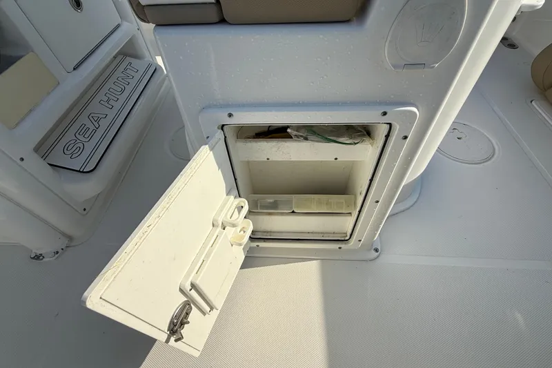 Slide: The Image of Open storage compartment on a 2017 Sea Hunt Gamefish 25 boat. - 24