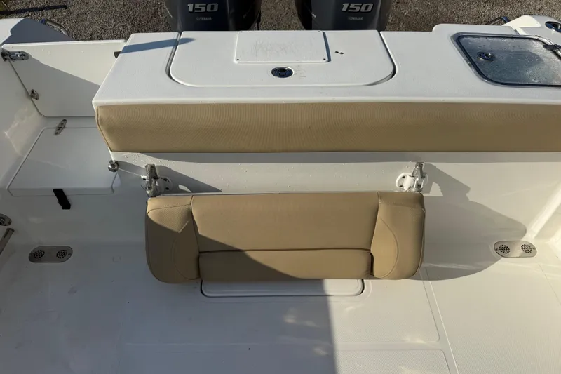Slide: The Image of 2017 Sea Hunt Gamefish 25 boat interior with beige seating and Yamaha 150 engines. - 31