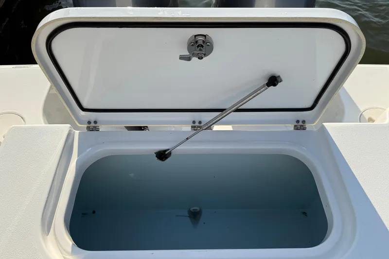 Slide: The Image of Open storage compartment on a 2017 Sea Hunt Gamefish 25 boat. - 32