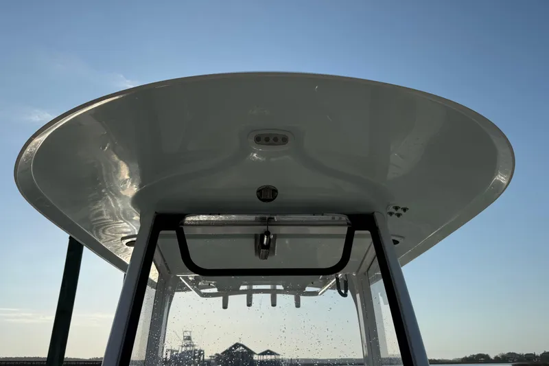 Slide: The Image of 2017 Sea Hunt Gamefish 25 boat canopy against clear blue sky. - 34