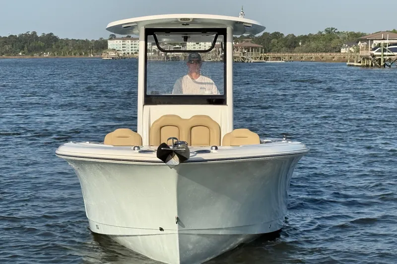 Slide: The Image of 2017 Sea Hunt Gamefish 25 boat on calm water, front view. - 4
