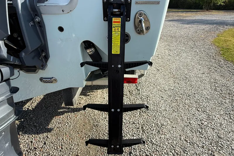 Slide: The Image of 2017 Sea Hunt Gamefish 25 boat ladder on gravel surface. - 41