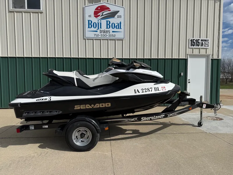The Image of 2012 Sea-Doo GTX 155 jet ski on trailer outside Boji Boat building. - 0