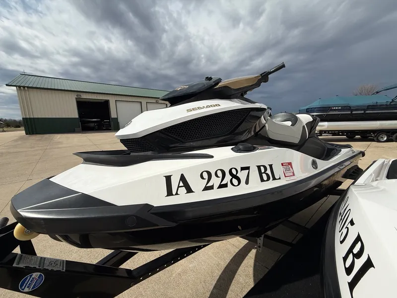 Slide: The Image of 2012 Sea-Doo GTX 155 jet ski on trailer, cloudy sky. - 4