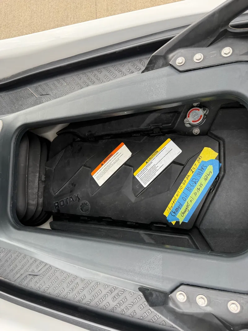 Slide: The Image of 2012 Sea-Doo GTX 155 engine cover with warning labels. - 7