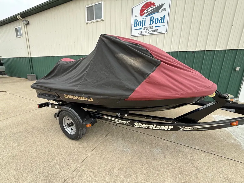 Slide: The Image of 2012 Sea-Doo GTX 155 jet ski on trailer, covered. - 9