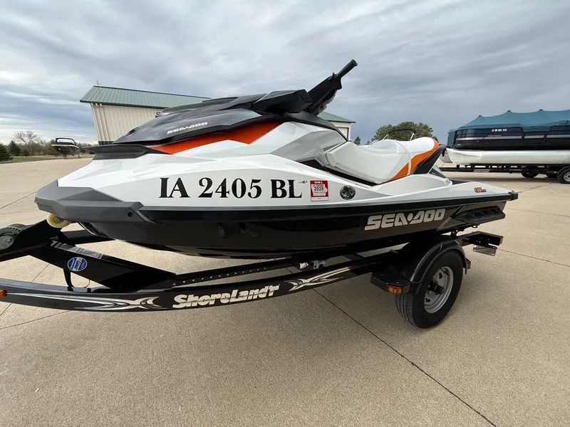 Slide: The Image of 2012 Sea-Doo GTI 130 jet ski on trailer, side view. - 2