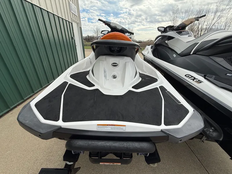 Slide: The Image of 2012 Sea-Doo GTI 130 jet ski parked outdoors. - 5