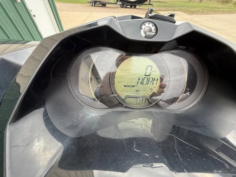 Slide: The Image of Dashboard of a 2012 Sea-Doo GTI 130 jet ski, displaying speed and mode. - 7