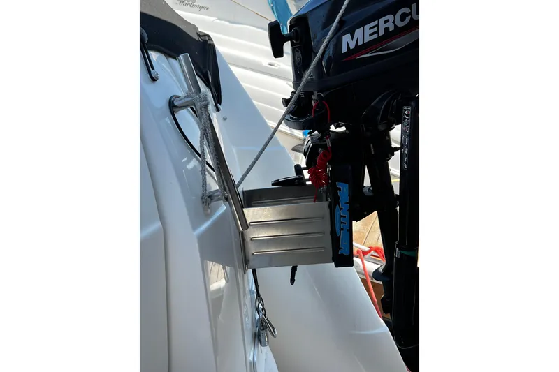 Slide: The Image of 2009 Rinker 340 Express Cruiser with Mercury outboard motor and stainless steel ladder. - 39