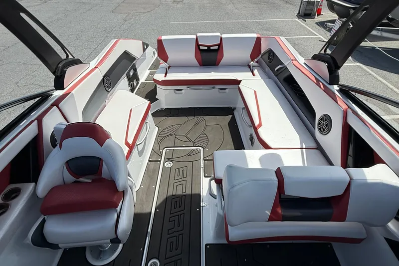 Slide: The Image of Interior of a 2022 Scarab 285 ID boat with red and white seating. - 10