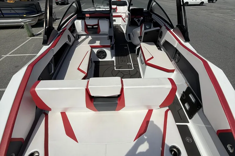 Slide: The Image of 2022 Scarab 285 ID boat interior with red and white seating, modern design. - 11