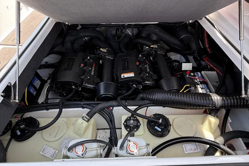 Slide: The Image of Engine compartment of a 2022 Scarab 285 ID boat, featuring dual Rotax engines. - 17