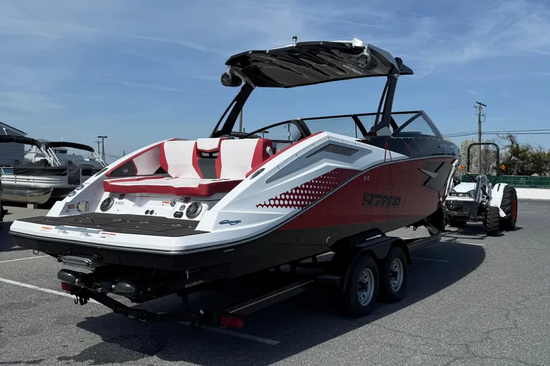 Slide: The Image of 2022 Scarab 285 ID boat on trailer, featuring sleek design and red accents. - 8