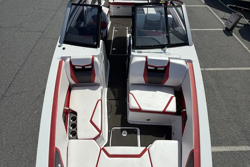 Slide: The Image of 2022 Scarab 285 ID boat interior with red and white seating, overhead view. - 9